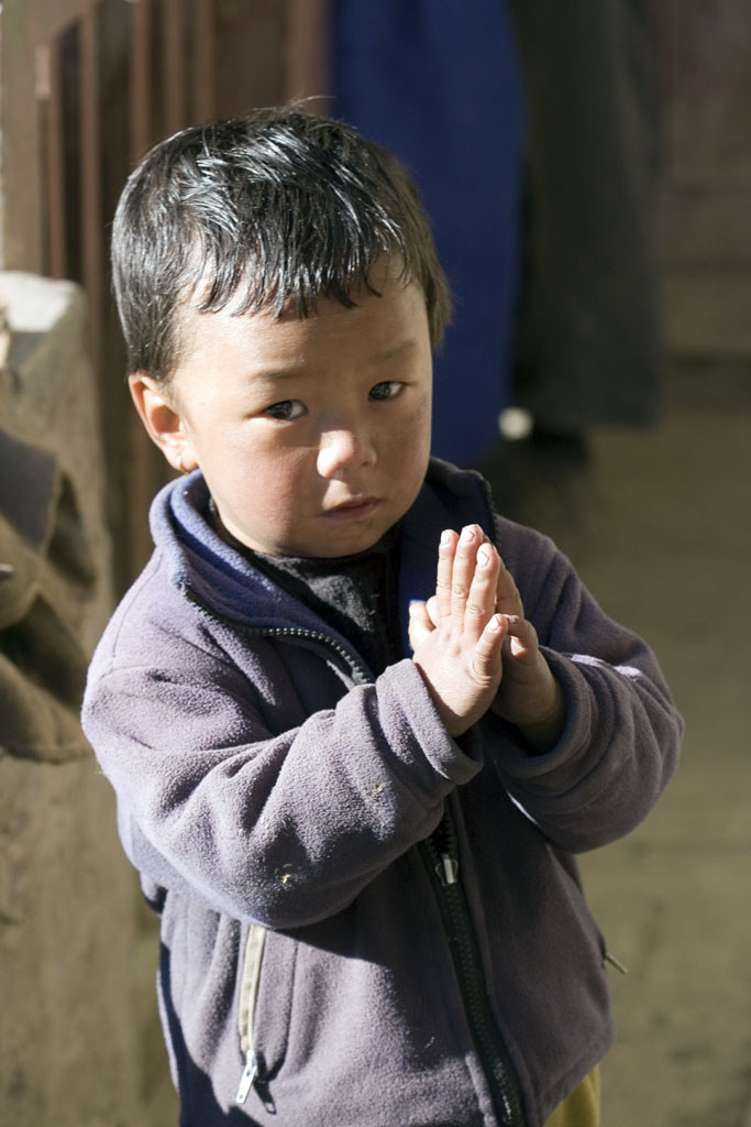 Namaste! traditional Nepali greeting from a child in Kagbeni, Nepal
